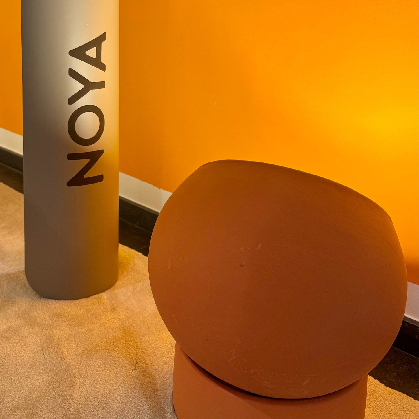 NOYA Elevated Mat - premium PU exercise mat for yoga, Pilates, and fitness. Minimalist home gym design in natural tones for mindful movement.