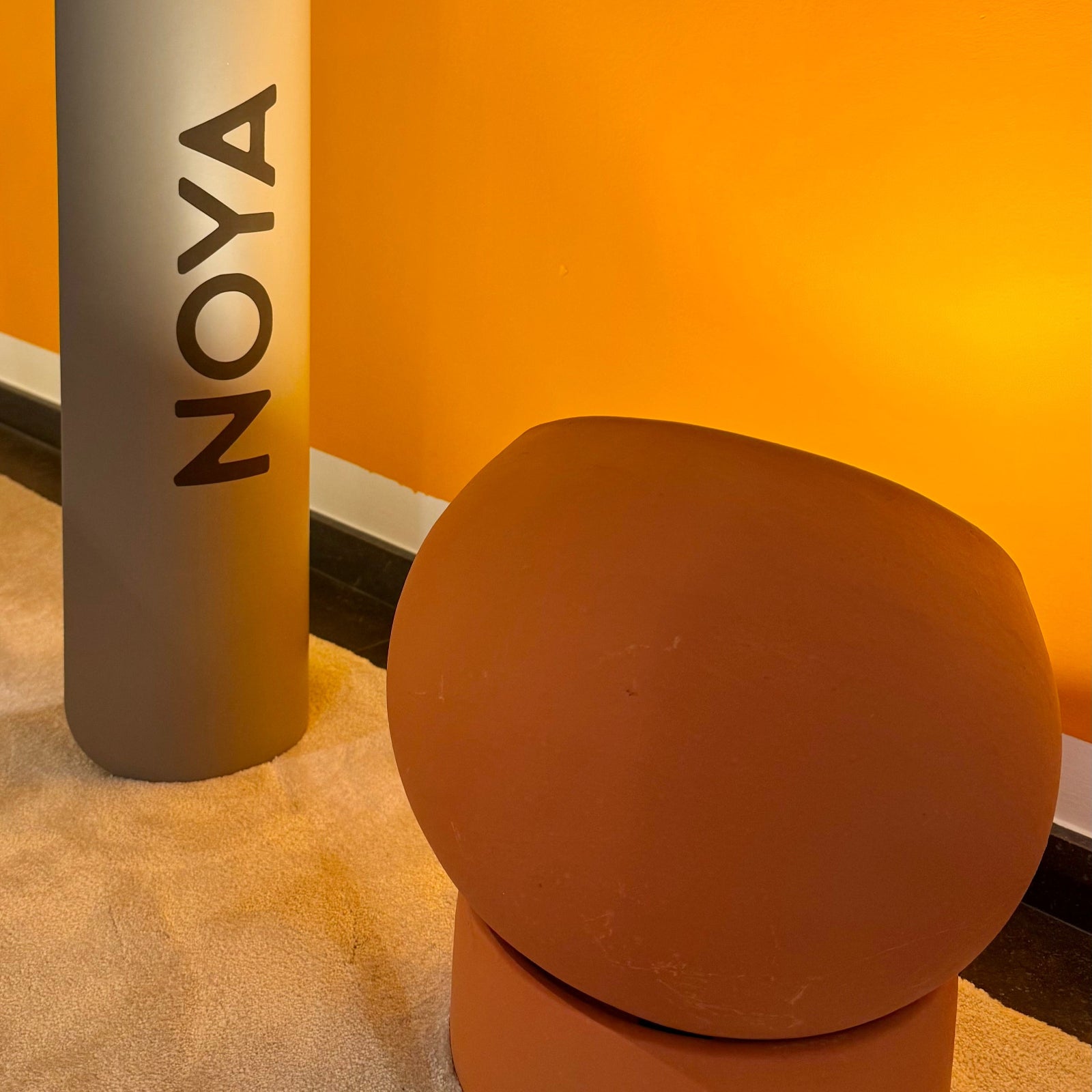 NOYA Elevated Mat - premium PU exercise mat for yoga, Pilates, and fitness. Minimalist home gym design in natural tones for mindful movement.
