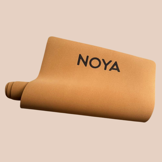 Cork mat with 'NOYA' branding, essential for workouts, pilates or yoga