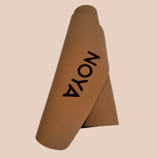 Cork mat with 'NOYA' branding, essential for workouts, pilates or yoga