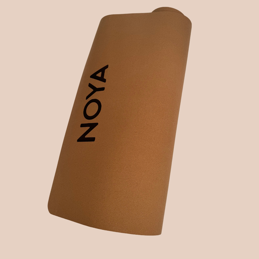 Cork mat with 'NOYA' branding, essential for workouts, pilates or yoga