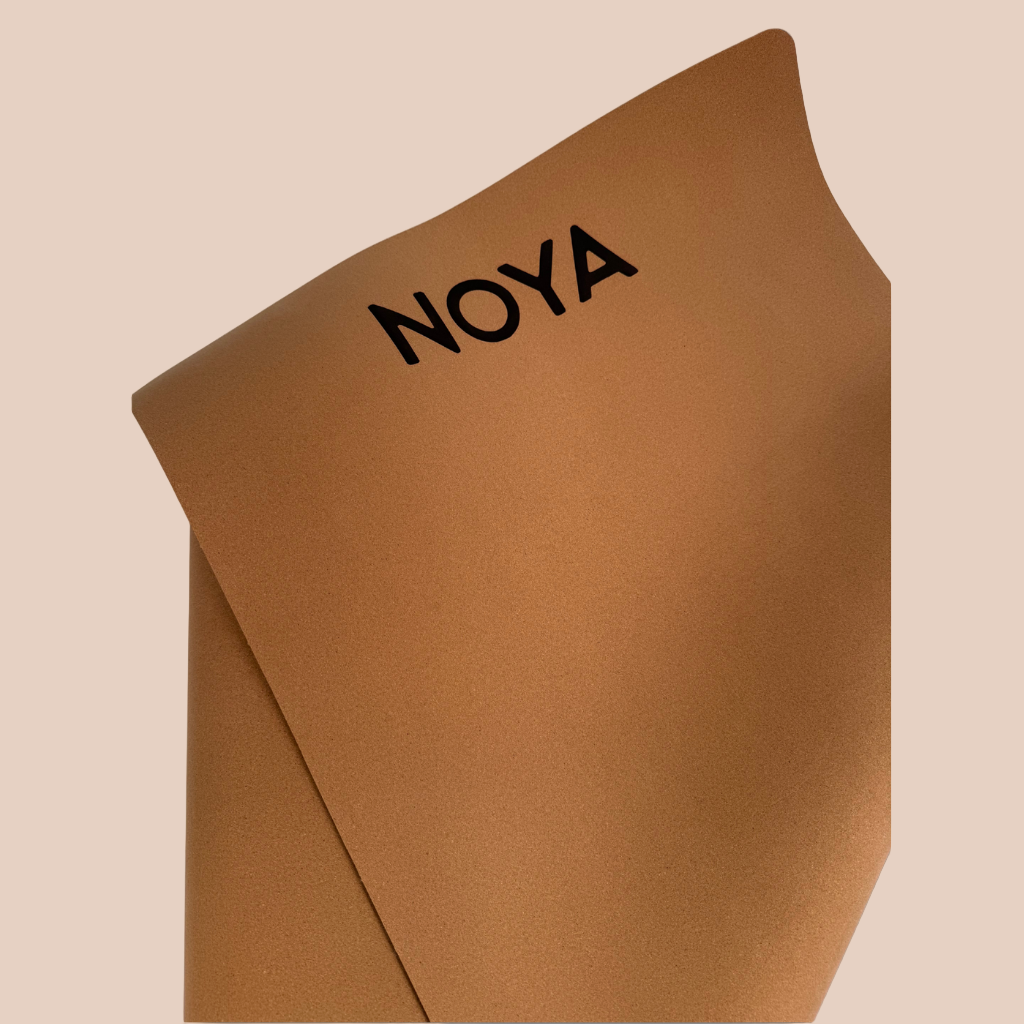 Cork mat with 'NOYA' branding, essential for workouts, pilates or yoga