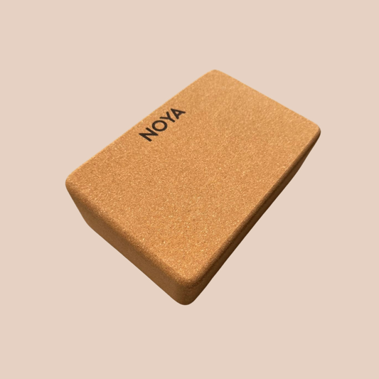 Cork block with 'NOYA' branding, essential for workouts, pilates or yoga