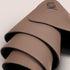 NOYA Elevated Mat in Mocha, aufgerollt
