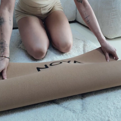 NOYA Grounded Mat unrolled at home: cork surface, natural rubber base, rolled and standing